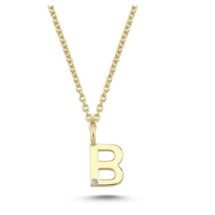 Nuran. 14 kt guldbogstav med diamant