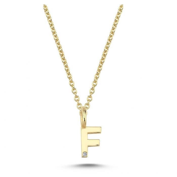 Nuran. 14 kt guldbogstav med diamant
