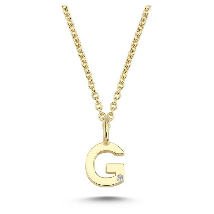 Nuran. 14 kt guldbogstav med diamant