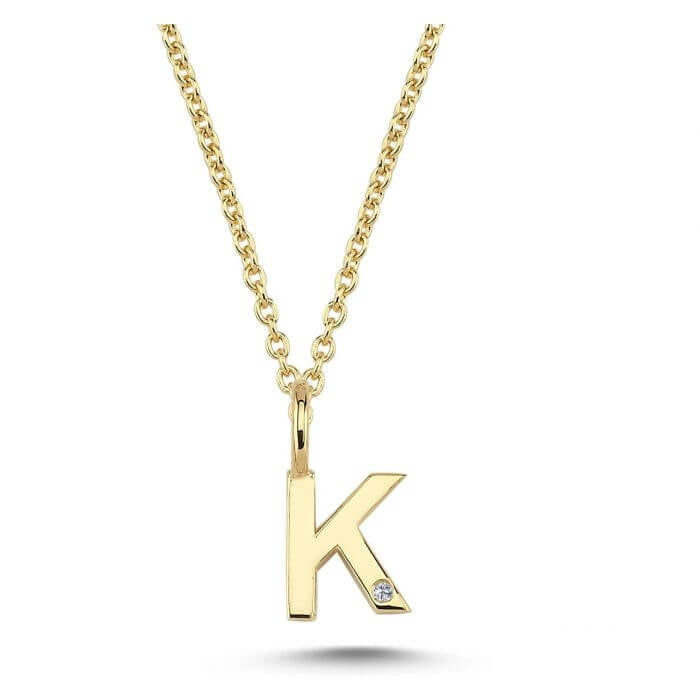 Nuran. 14 kt guldbogstav med diamant