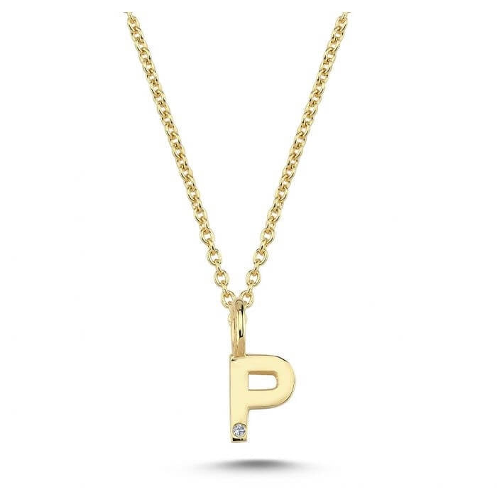 Nuran. 14 kt guldbogstav med diamant