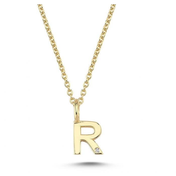 Nuran. 14 kt guldbogstav med diamant