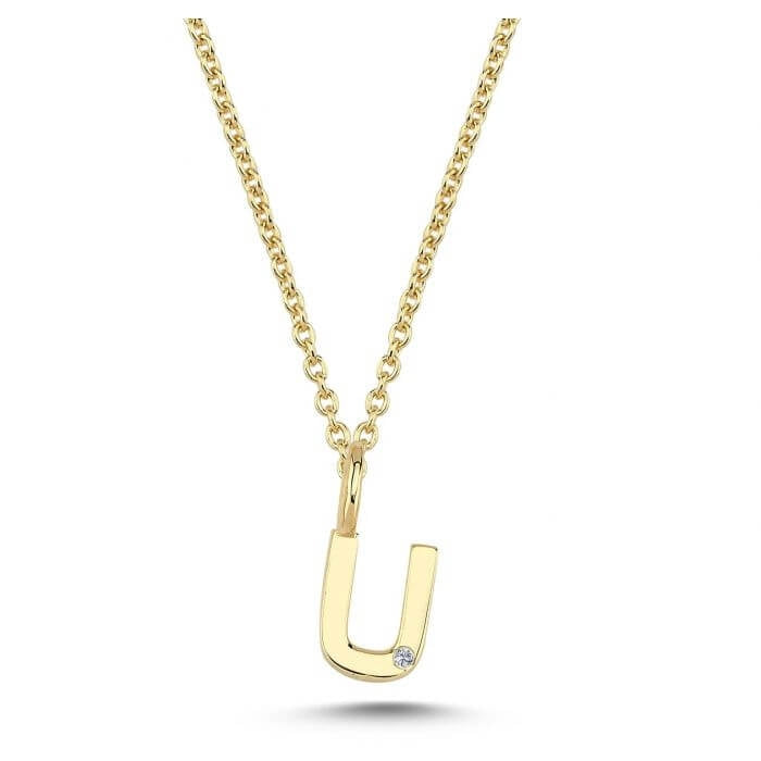 Nuran. 14 kt guldbogstav med diamant