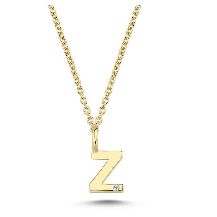 Nuran. 14 kt guldbogstav med diamant